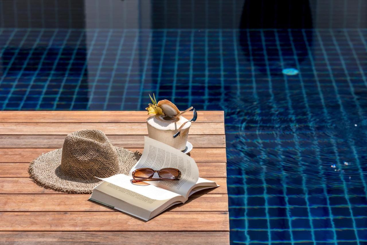 Outrigger Surin Beach Resort - Sha Extra Plus Екстериор снимка A poolside table