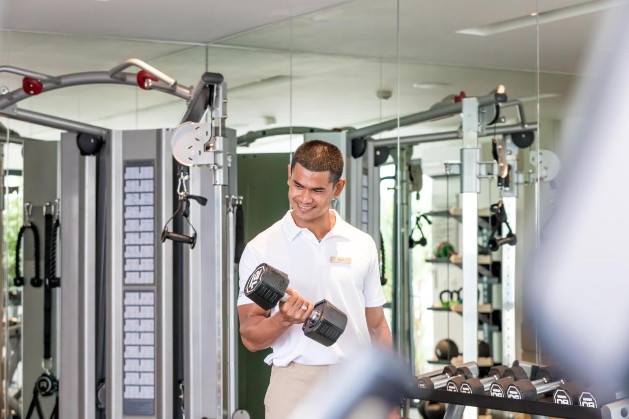 Outrigger Surin Beach Resort - Sha Extra Plus Екстериор снимка A man lifting a dumbbell