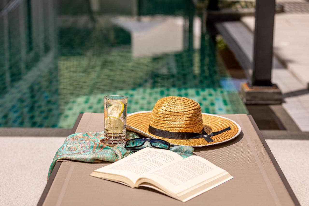 Outrigger Surin Beach Resort - Sha Extra Plus Екстериор снимка A poolside table